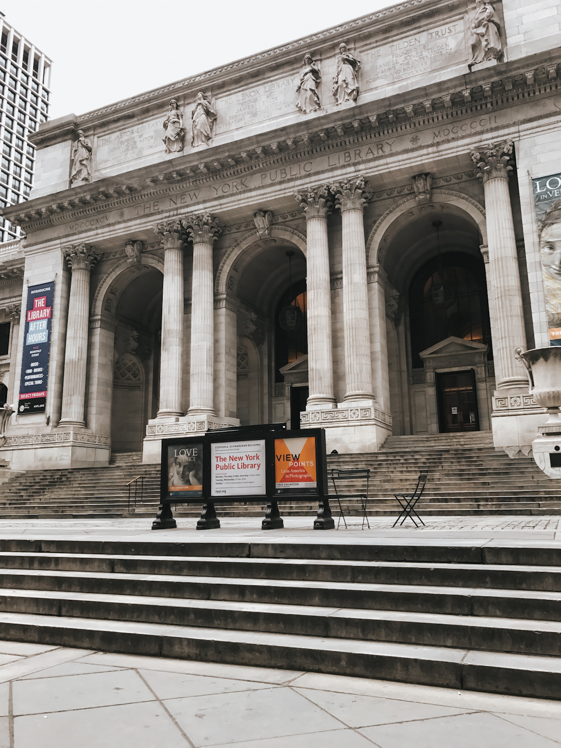 New York Public Library Beaux-Arts facade with marble columns and stone steps on Fifth Avenue